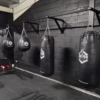 Heavy bags on the boxing wall